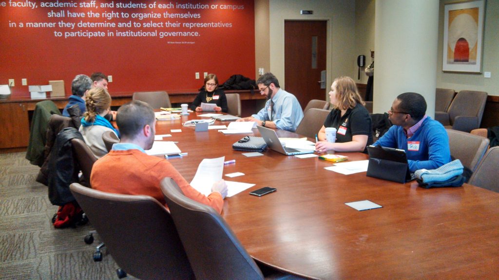 Community of Practice meeting around a table.